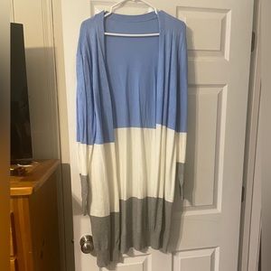 Long sweater with cool colors.